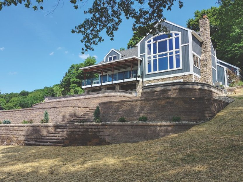 Backyard patio with built-in fire feature near Canton Ohio