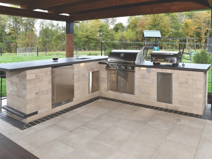 Custom hardscape design with built-in lighting in Akron Ohio